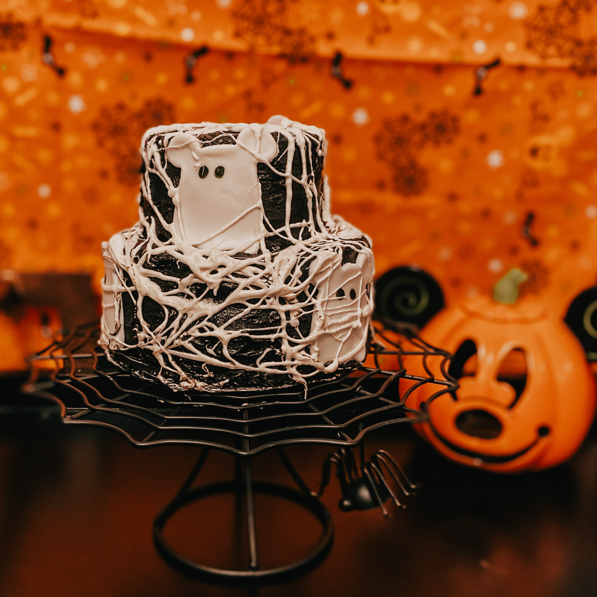 spiderweb cake with mickey ghost shapes