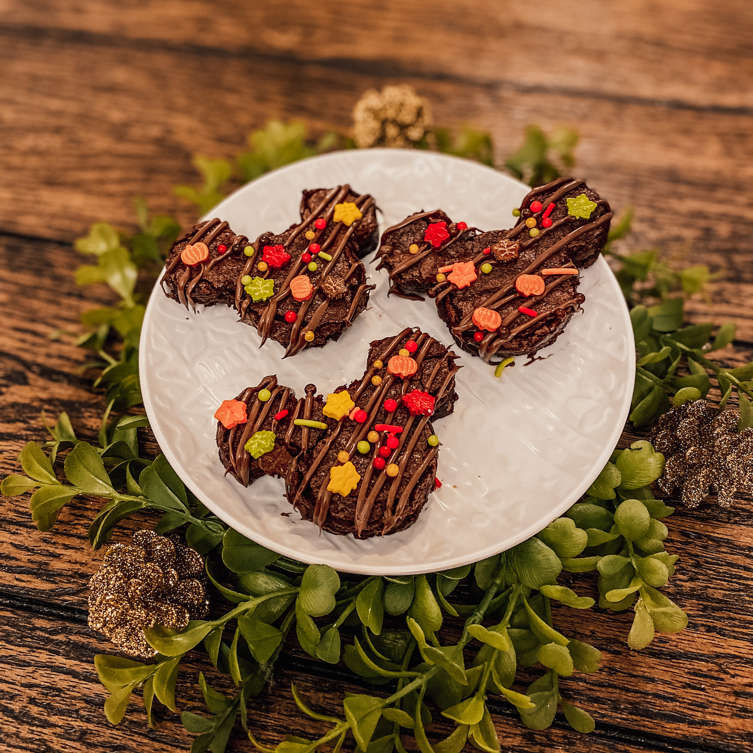 three mickey brownies with nutella and sprinkles on a plate