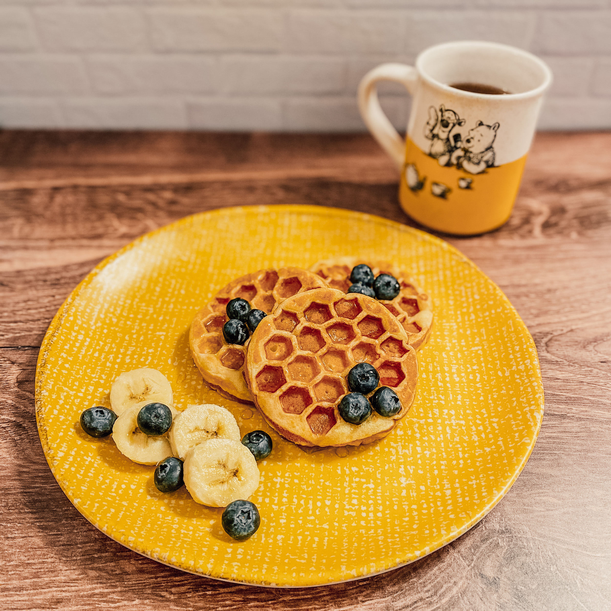 Pooh's Honeycomb Waffles on a yellow plate