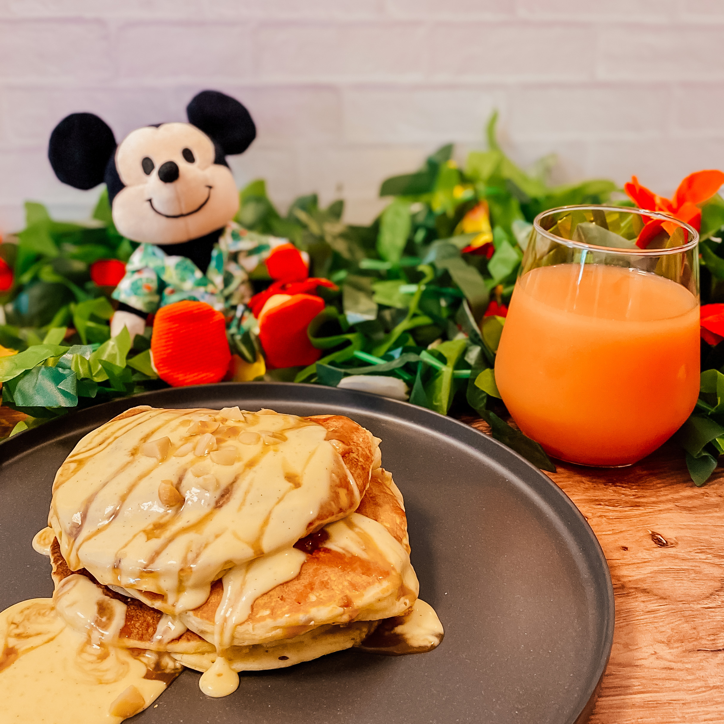 Disney's Aulani Macadamia Nut Pancakes on a plate with POG Juice