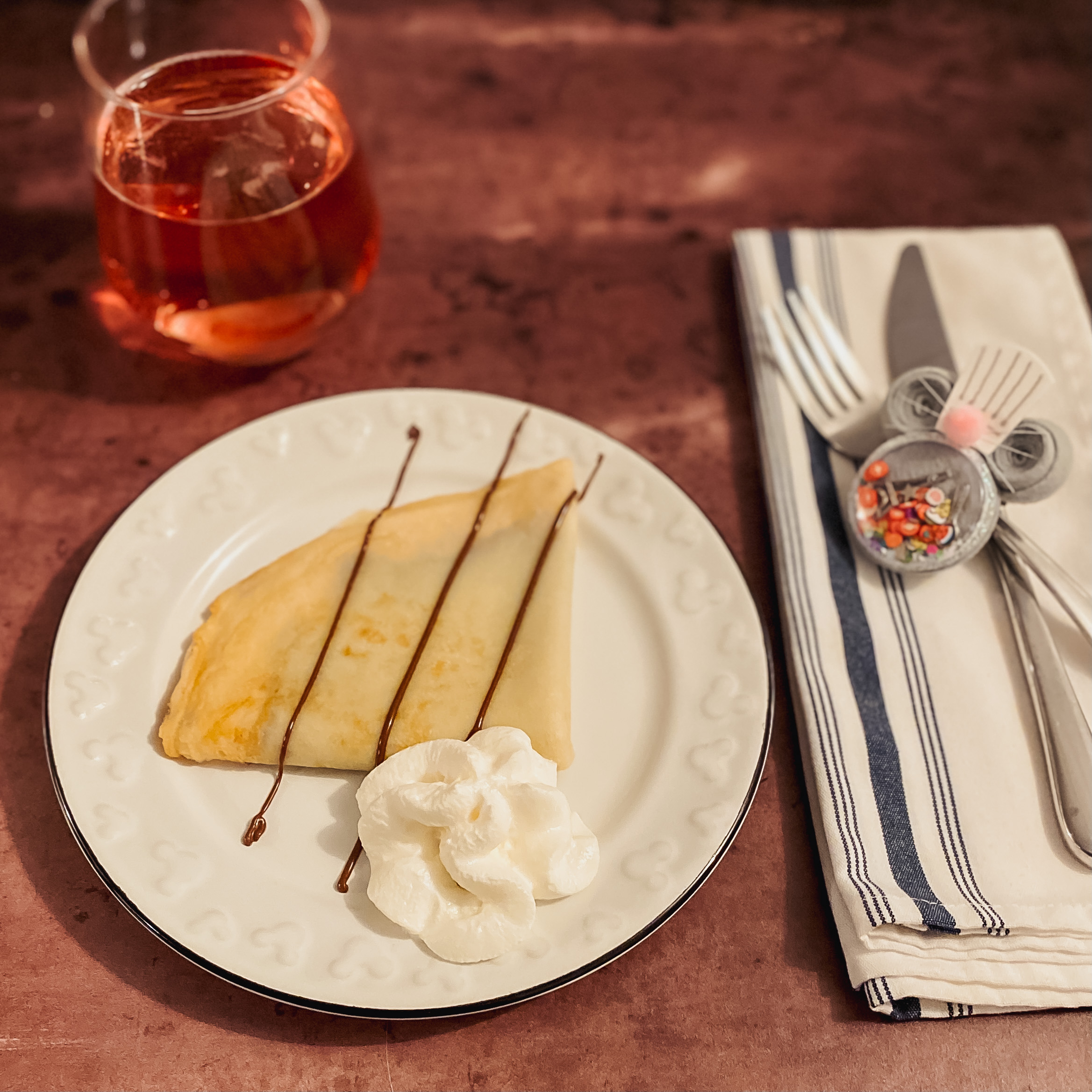 nutella crepe on plate with hard cider