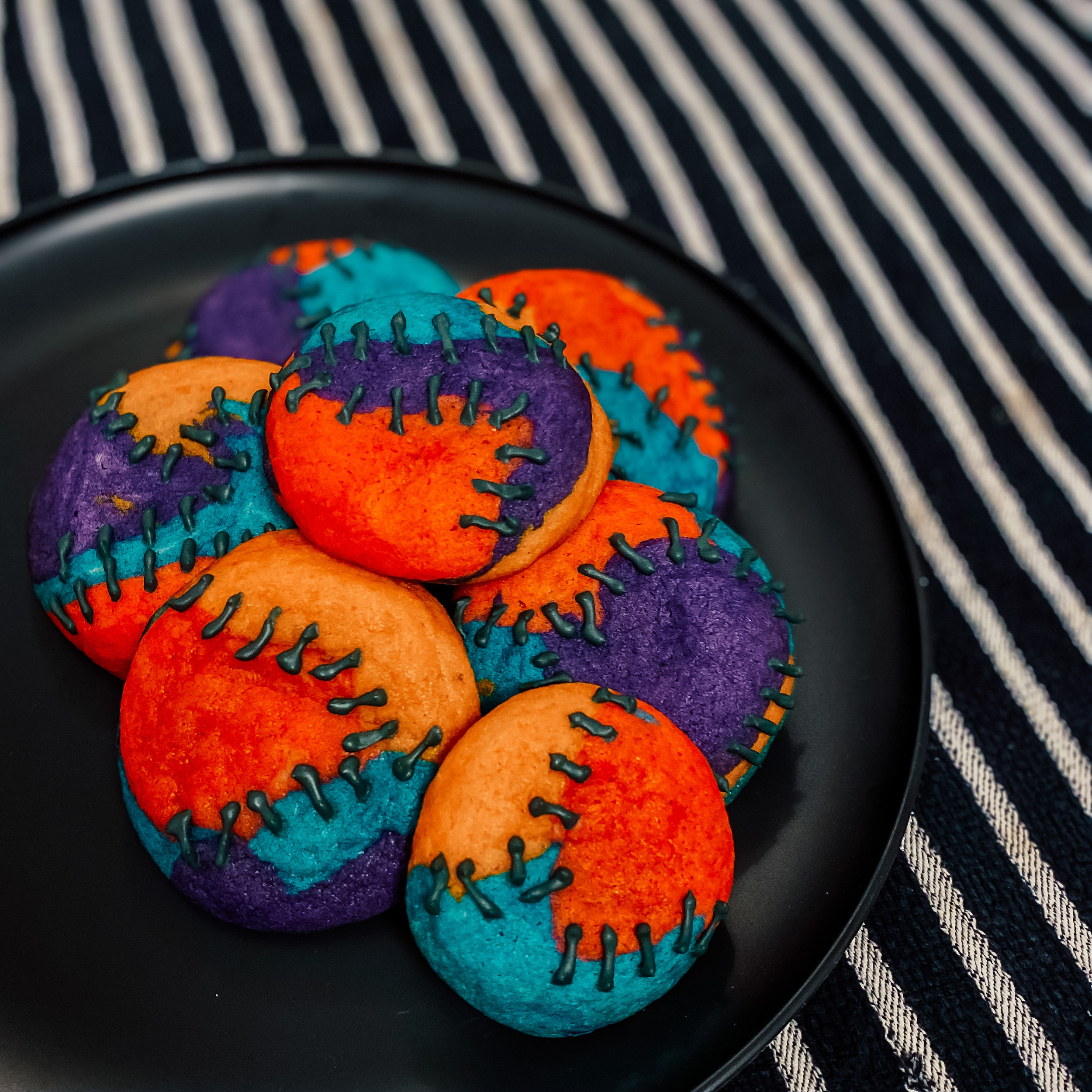 Sally's Sugar Cookies piled on a black plate