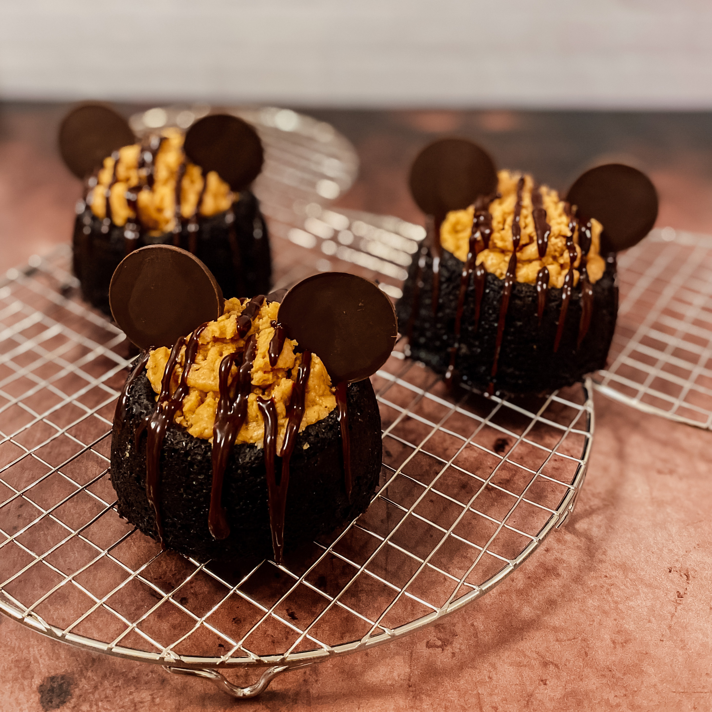 Chocolate Peanut Butter Mickey Cakes on a Mickey shaped cooling rack