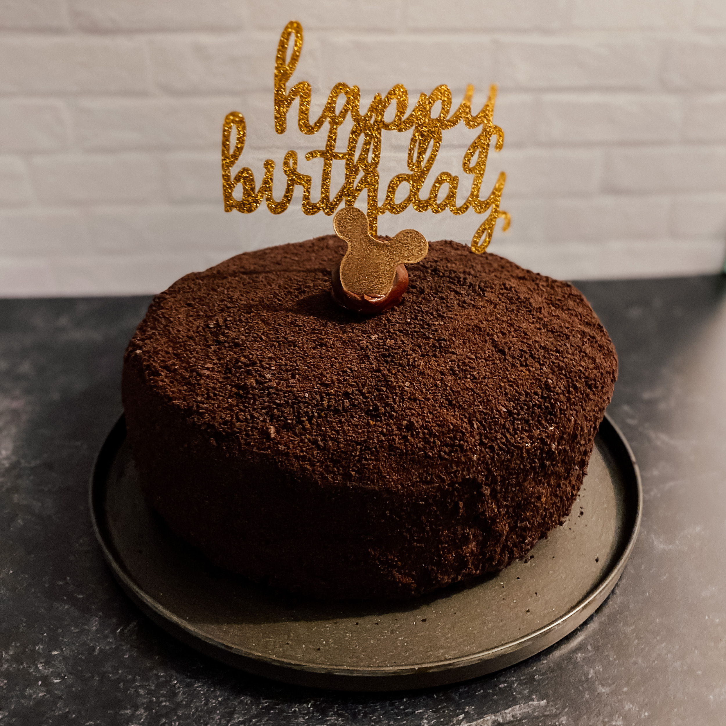 devil's food cake with happy birthday cake topper and mickey mouse chocolate