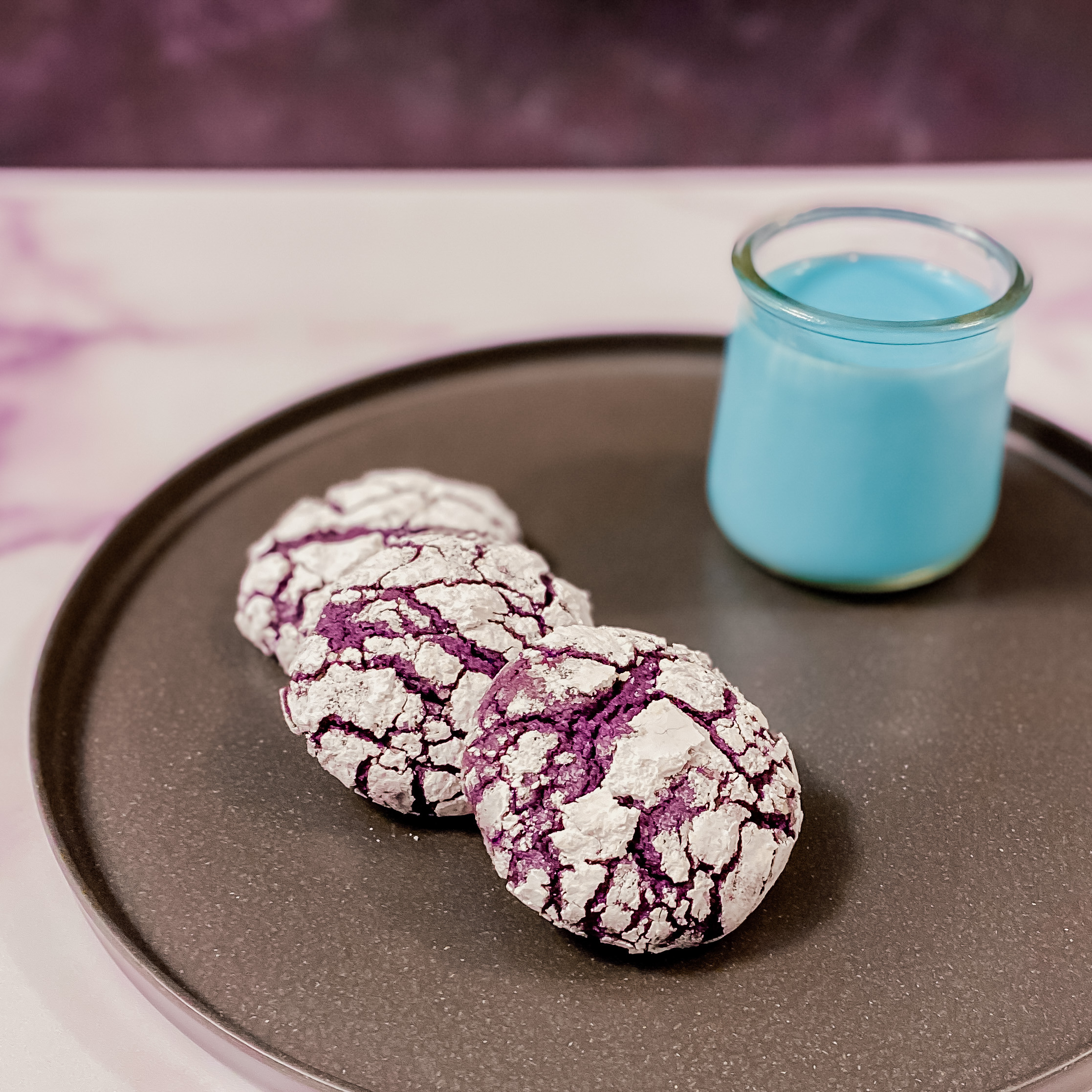 Star Wars Amethyst Sweetbread, Ube Cookies on a plate with a small glass of blue milk