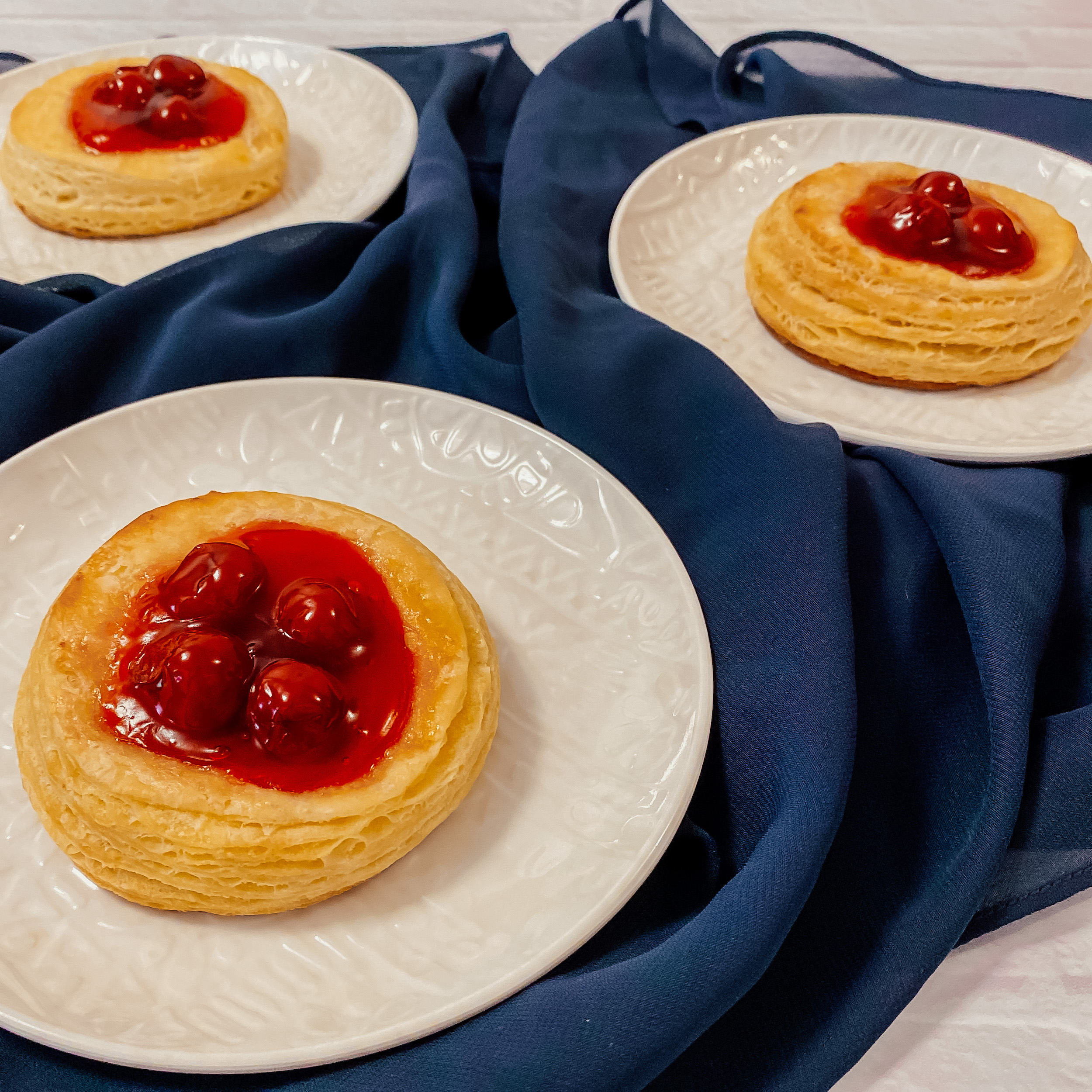 Doctor Strange's Portal Pastries (Round cherry danishes) on plates