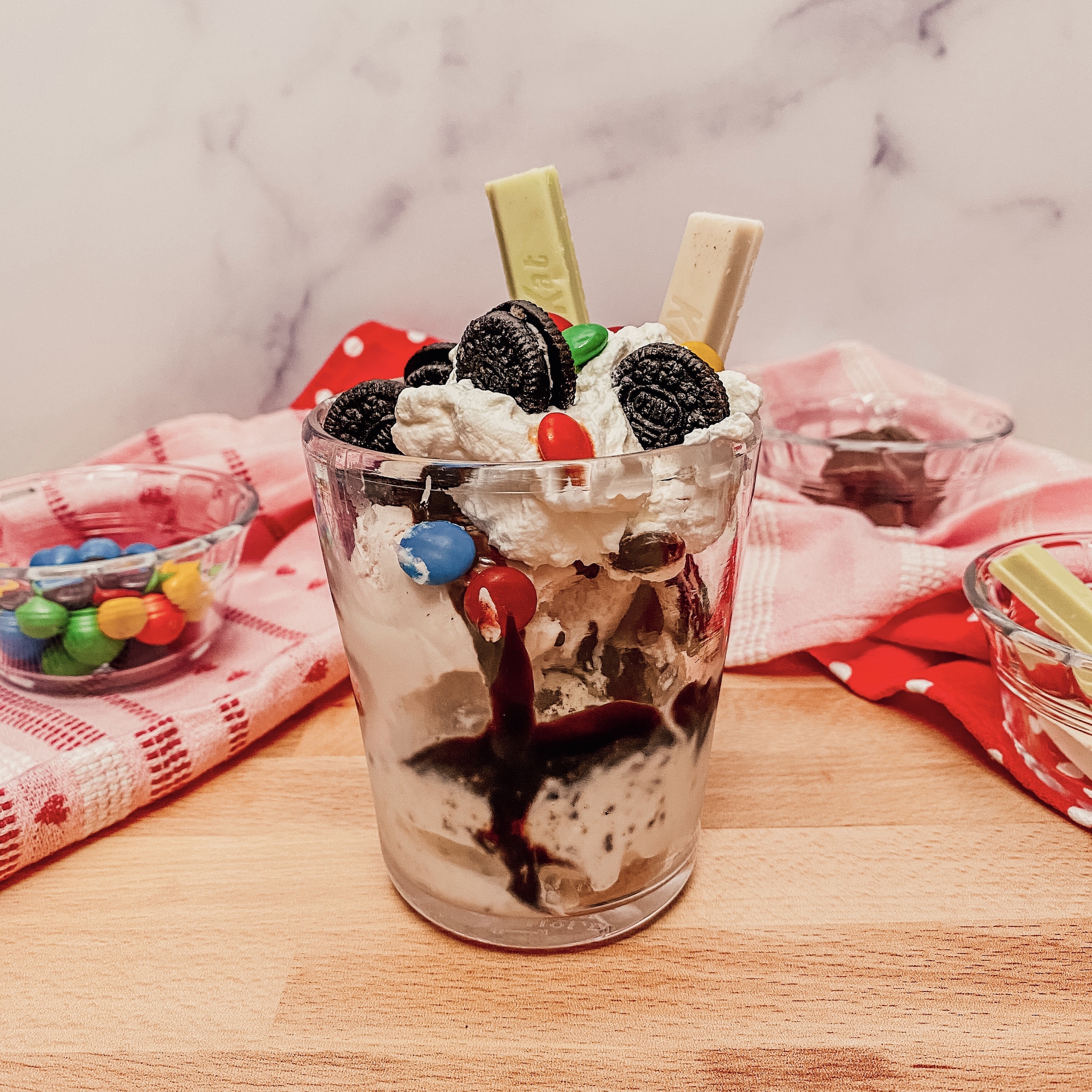 Vanellope's Sugar Rush Sundae (Ice cream sundae with oreo cookies, chocolate sauce, whipped cream, and candies)