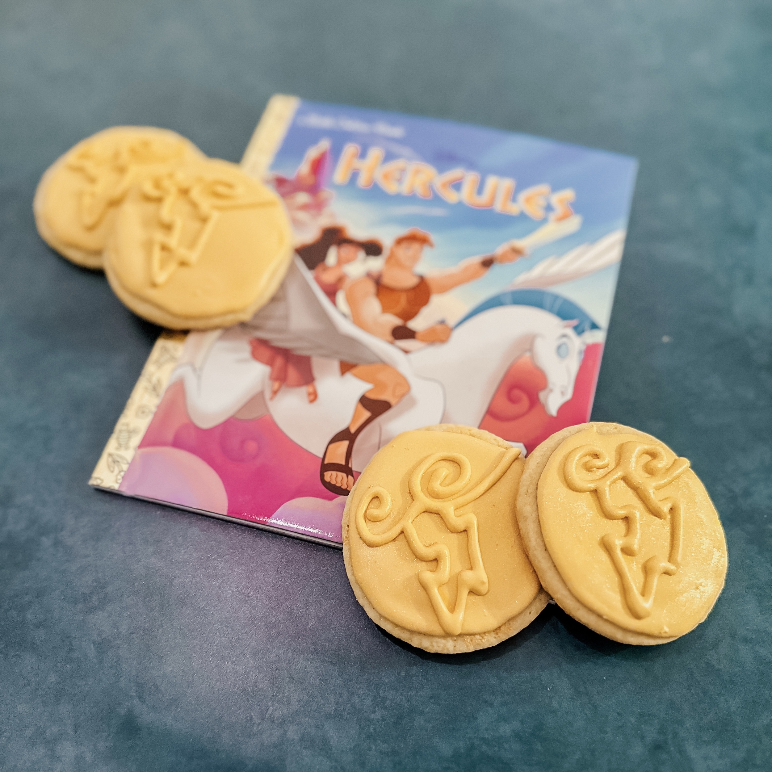 Hercules' Medal of the Gods Cookies (Sugar cookies with gold royal icing and a piped design of clouds and a lightning bolt)
