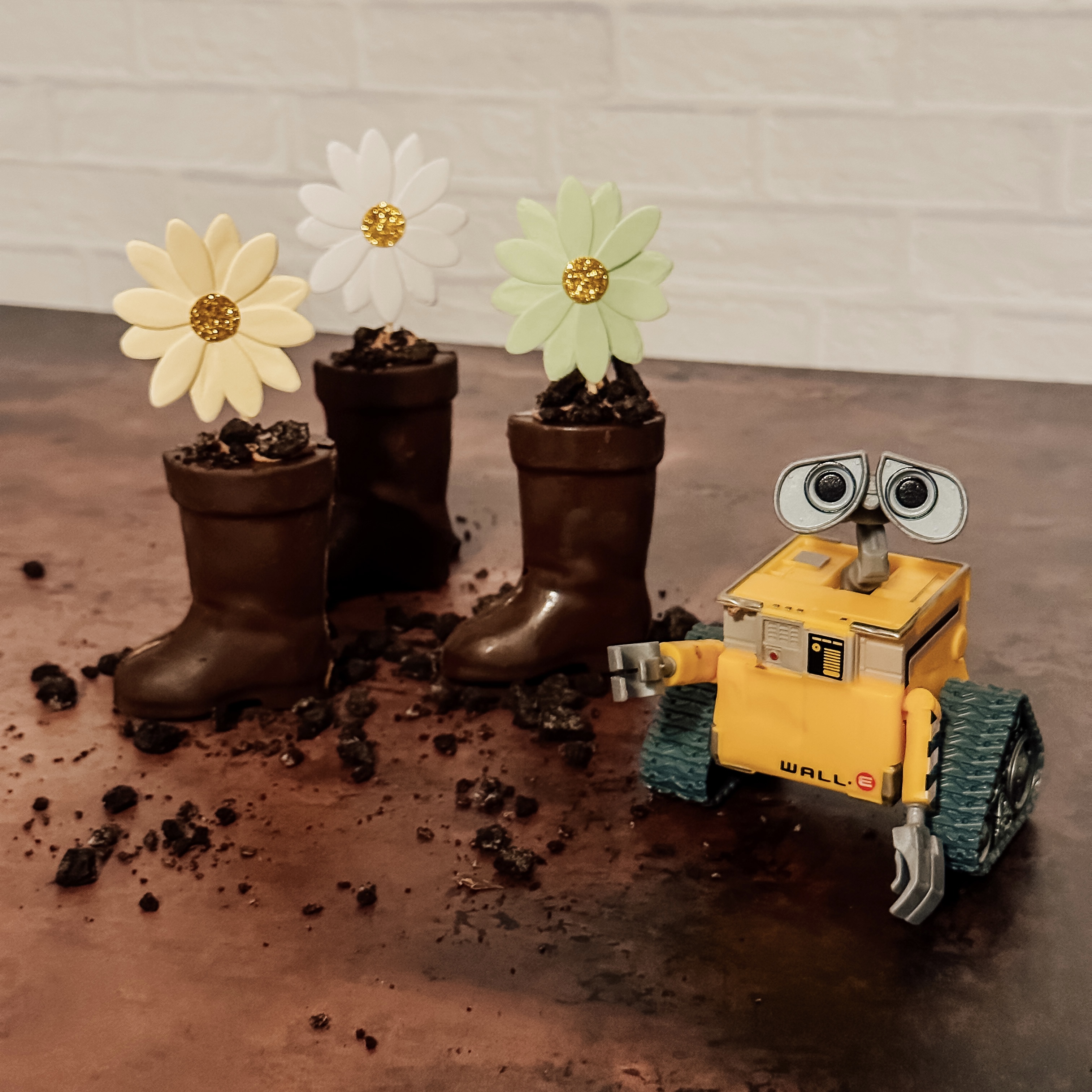 WALL-E's Chocolate Mousse Boots (three chocolate boots filled with chocolate mousse and topped with oreo crumbs and a flower).
