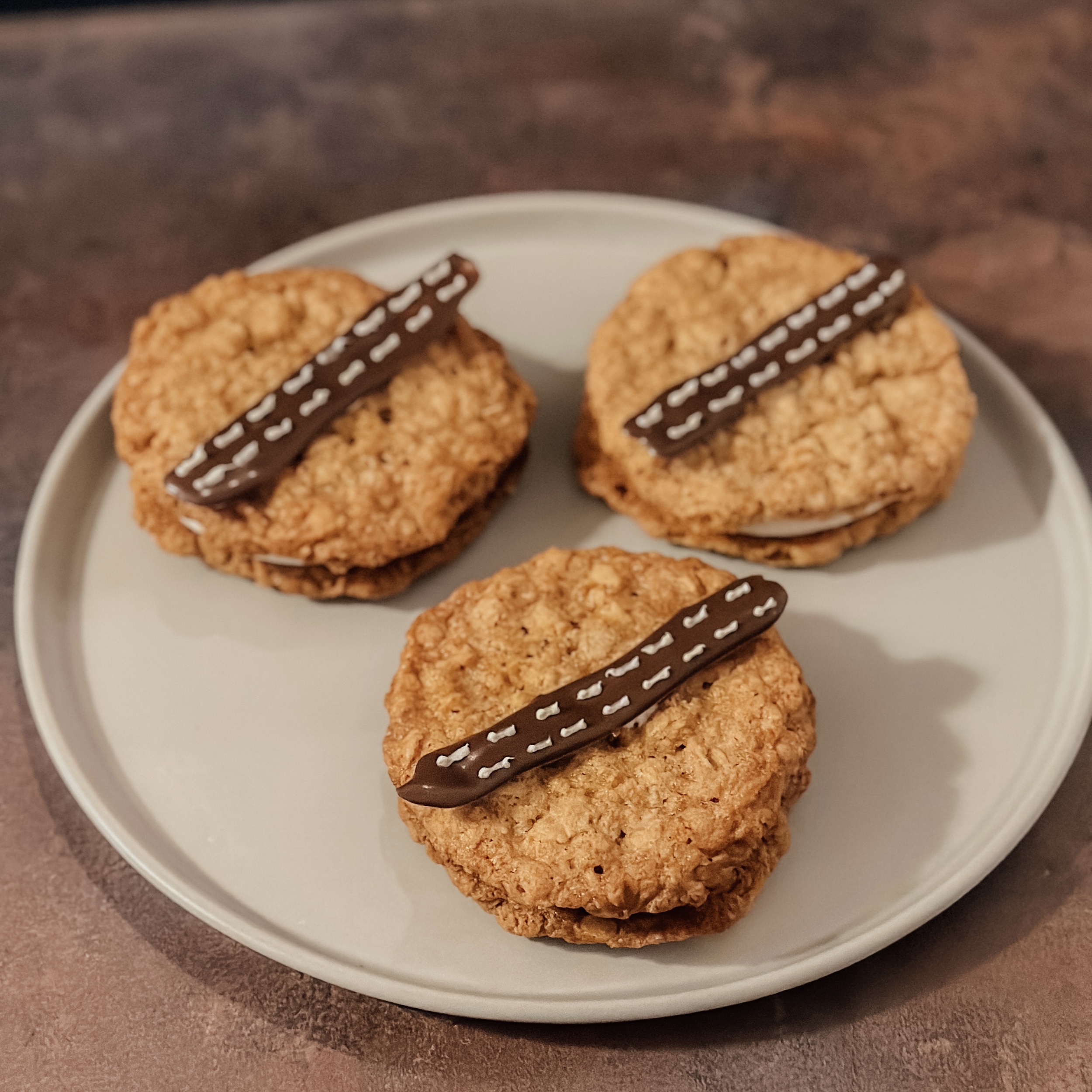 Wookie Cookie Sandwiches (oatmeal cookie sandwiches with marshmallow filling and chocolate decoration)