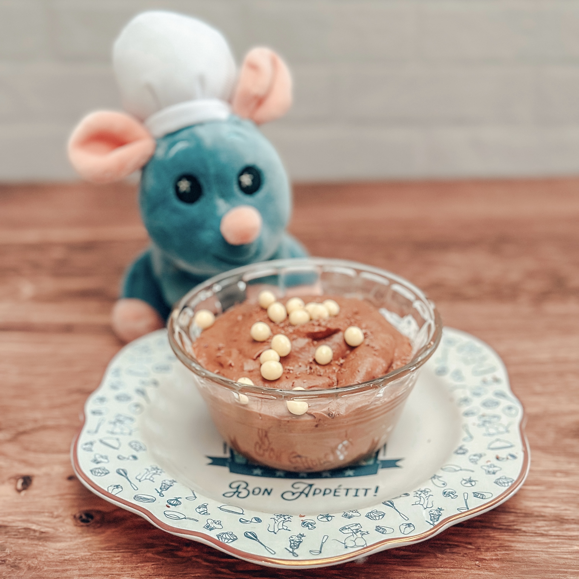 Les Halles Mousse au Chocolat in a bowl with plush Remy and Emil
